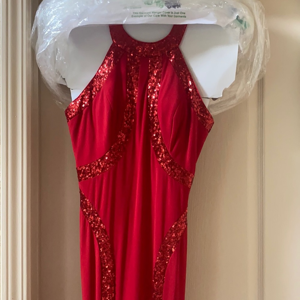 Beautiful red prom dress. Fits really well. Loose material